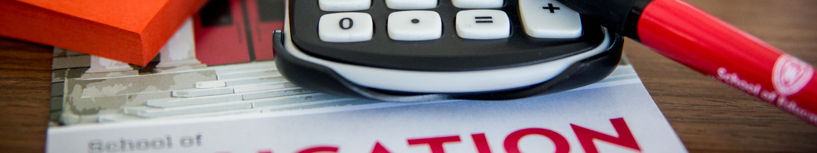 calculator on top of brochures