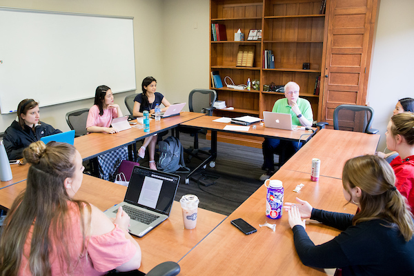 group of students and professor sit in a uw madison classroom